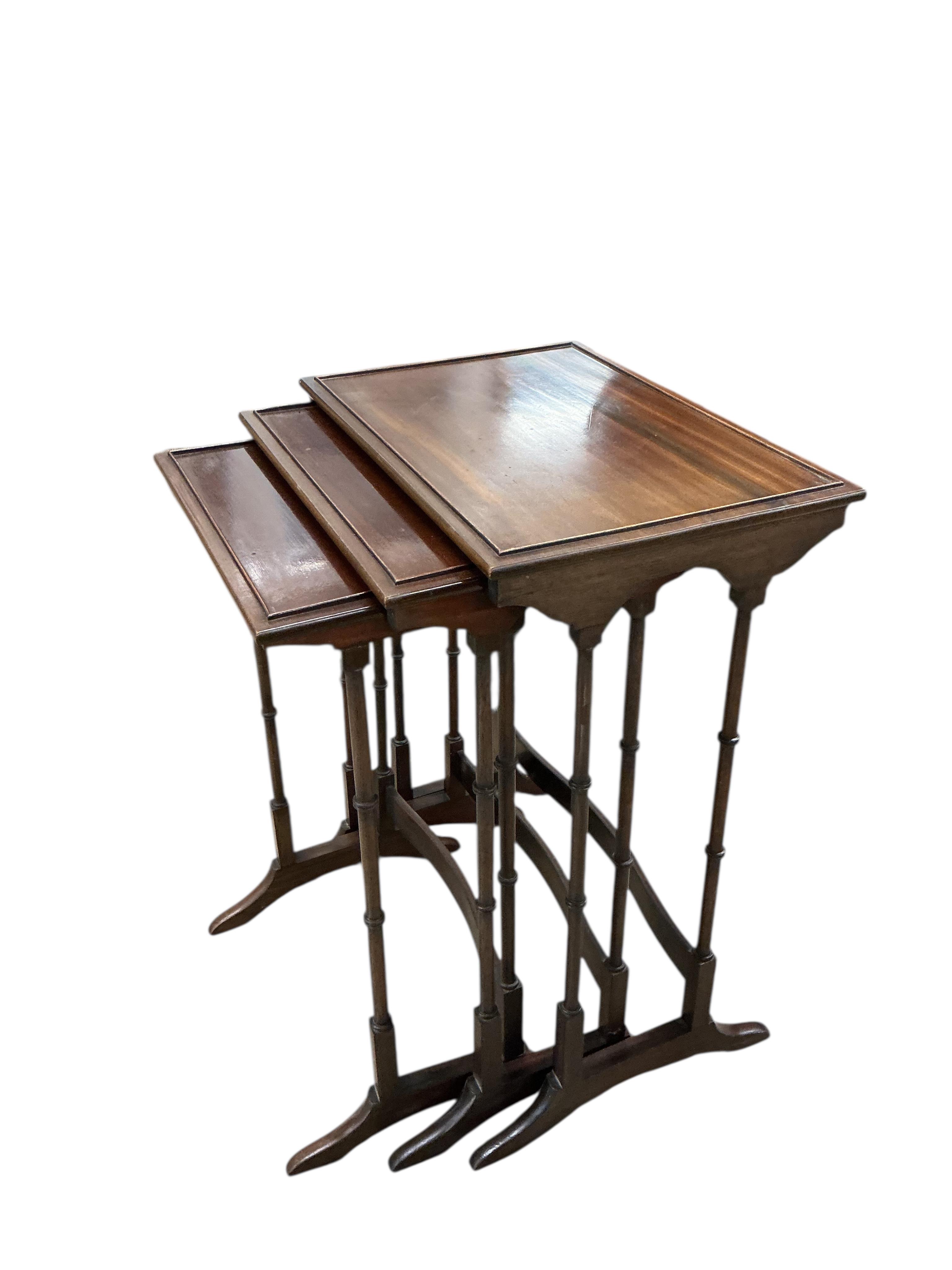 A nest of three Edwardian rectangular mahogany tea tables, width 50cm, depth 35cm, height 71cm